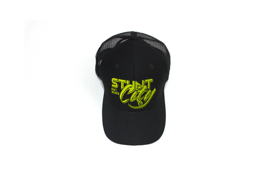 Black trucker hat with green stunt city logo